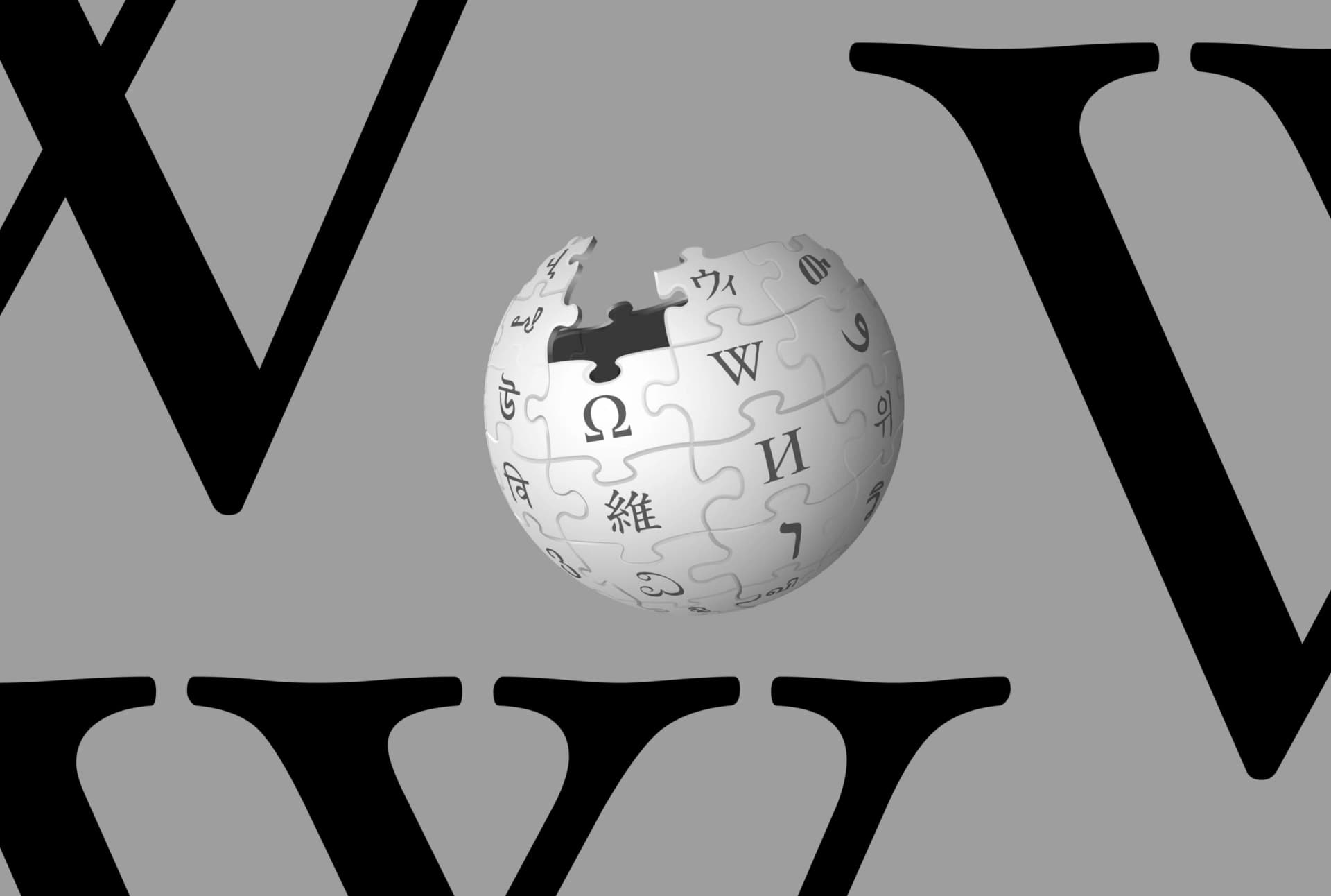 Logotipo da Wikipedia com a letra W e um globo sobre fundo cinza
